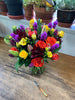 Lush and full cut flower arrangement in a 6x8 inch Gathering Vase with Colorado greenhouse grown flowers and Dutch Tulips and South American flowers